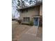 Charming two-story brick home with a blue front door and well maintained front yard at 1652 W Campbell Ave, Phoenix, AZ 85015
