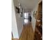Inviting hallway with hardwood floors, leading to a bright, sunlit room at 1652 W Campbell Ave, Phoenix, AZ 85015