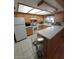 Functional kitchen with wood cabinets, white countertops, and modern appliances at 1652 W Campbell Ave, Phoenix, AZ 85015