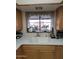 Kitchen sink with a window and plants above, complimented by wood cabinets at 1652 W Campbell Ave, Phoenix, AZ 85015