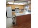 Well-equipped kitchen featuring white countertops, wood cabinets, and modern appliances at 1652 W Campbell Ave, Phoenix, AZ 85015