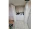 Bright laundry room with a washer, dryer and overhead storage at 1652 W Campbell Ave, Phoenix, AZ 85015