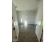Bright bedroom with wood-look floors, white walls, and an entry featuring double doors at 17422 W Las Palmaritas Dr, Waddell, AZ 85355