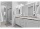Bathroom featuring double sinks, granite countertops, and a shower at 20408 E Rosa Rd, Queen Creek, AZ 85142