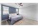 Bright bedroom with a ceiling fan, natural light, and hardwood flooring at 20408 E Rosa Rd, Queen Creek, AZ 85142