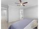 Spacious primary bedroom with a ceiling fan, and a view to the primary bathroom at 20408 E Rosa Rd, Queen Creek, AZ 85142