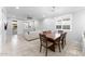 Inviting dining area with a wooden table and stylish chairs next to a view of the living room at 20408 E Rosa Rd, Queen Creek, AZ 85142