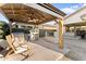 Outdoor gazebo with a built-in grill, beverage cooler, bar area, and comfortable seating, ideal for backyard entertaining at 20408 E Rosa Rd, Queen Creek, AZ 85142