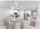 Stylish kitchen boasts granite countertops, stainless steel appliances, and an island with breakfast bar seating at 20408 E Rosa Rd, Queen Creek, AZ 85142