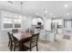 Bright kitchen features a large island, granite countertops, and white cabinetry, perfect for culinary enthusiasts at 20408 E Rosa Rd, Queen Creek, AZ 85142