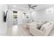 Cozy living room with a large sectional sofa and sliding doors leading to the backyard at 20408 E Rosa Rd, Queen Creek, AZ 85142