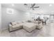 Spacious living room with a large sectional sofa, ceiling fan and open layout great for entertaining at 20408 E Rosa Rd, Queen Creek, AZ 85142