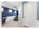 View from hallway into office with blue walls and a door to a main living area at 20408 E Rosa Rd, Queen Creek, AZ 85142