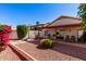Charming backyard featuring desert landscaping, covered patio, and mature trees for relaxing and entertaining at 2120 E Daley Ln, Phoenix, AZ 85024