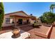 Backyard patio with a firepit and an outdoor eating area perfect for gatherings at 2120 E Daley Ln, Phoenix, AZ 85024