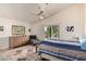 Spacious bedroom with a sliding glass door to a patio, a ceiling fan, and carpeted floors at 2120 E Daley Ln, Phoenix, AZ 85024