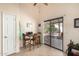Bright dining area with sliding glass doors to a patio and natural light at 2120 E Daley Ln, Phoenix, AZ 85024