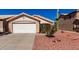 Charming single-story home with a two-car garage and desert landscaping at 2120 E Daley Ln, Phoenix, AZ 85024