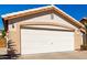 Attached two car garage with white door at 2120 E Daley Ln, Phoenix, AZ 85024