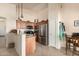 Bright kitchen with stainless steel appliances, pendant lighting, and a breakfast bar at 2120 E Daley Ln, Phoenix, AZ 85024