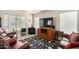 Cozy living room featuring plush seating, a large television, and plenty of natural light at 2120 E Daley Ln, Phoenix, AZ 85024