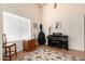 Bright living room with hardwood floors, vaulted ceilings, piano and guitar at 2120 E Daley Ln, Phoenix, AZ 85024