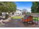 Backyard featuring a chicken coop, grassy lawn, and patio furniture at 2129 E Leo Pl, Chandler, AZ 85249