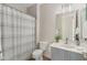Neutral-toned bathroom with a shower-tub combination, single sink vanity, and great natural light at 2129 E Leo Pl, Chandler, AZ 85249