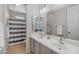 Bright bathroom featuring double sinks, a large mirror, and a shower-tub combo with modern fixtures at 2129 E Leo Pl, Chandler, AZ 85249