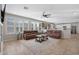 Cozy living room featuring tile floors, plantation shutters, and an open concept design at 2129 E Leo Pl, Chandler, AZ 85249