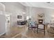 Open concept living room and dining area featuring a fireplace, ample seating, and high ceilings at 2129 E Leo Pl, Chandler, AZ 85249