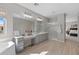 Large main bathroom features a double vanity, soaking tub, and a glass-enclosed shower at 2129 E Leo Pl, Chandler, AZ 85249