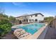 Backyard showcasing a sparkling pool with lounge chairs and a well-maintained fence for privacy at 2129 E Leo Pl, Chandler, AZ 85249