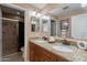 The bathroom features a double sink vanity with granite countertops at 2318 E Flower St, Phoenix, AZ 85016