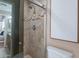 Bathroom with a tiled shower and glass doors at 2318 E Flower St, Phoenix, AZ 85016