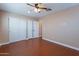 This room features a ceiling fan and built-in closet at 2318 E Flower St, Phoenix, AZ 85016
