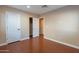 This bedroom with a ceiling fan and ensuite bathroom is ready for move-in at 2318 E Flower St, Phoenix, AZ 85016