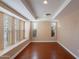 Bright bedroom with large windows, providing natural light, and beautiful wood floors at 2318 E Flower St, Phoenix, AZ 85016