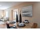 Bright dining area showcasing a wooden table, stylish decor, and a glimpse into the inviting living room at 2318 E Flower St, Phoenix, AZ 85016
