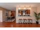 Bright and airy dining area adjacent to the kitchen with stylish seating at 2318 E Flower St, Phoenix, AZ 85016