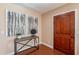 Inviting entryway features a stylish console table and elegant wood flooring at 2318 E Flower St, Phoenix, AZ 85016