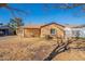 Quaint home featuring well-maintained landscaping and a lattice-covered porch at 2318 E Flower St, Phoenix, AZ 85016