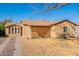 This cozy home has mature landscaping and a lattice-covered porch, adding curb appeal at 2318 E Flower St, Phoenix, AZ 85016