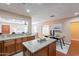 Open kitchen design featuring wood cabinets, granite countertops, stainless appliances, and an island at 2318 E Flower St, Phoenix, AZ 85016