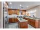 Modern kitchen featuring wood cabinets, stainless appliances, granite countertops, and ample counter space at 2318 E Flower St, Phoenix, AZ 85016