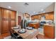 Charming kitchen featuring wood cabinets, stainless appliances, and a dining table with modern decor at 2318 E Flower St, Phoenix, AZ 85016