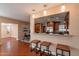 Modern kitchen view showcasing a breakfast bar, stainless steel appliances, and pendant lighting at 2318 E Flower St, Phoenix, AZ 85016