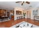 Open-concept living room and kitchen layout with modern furnishings and finishes at 2318 E Flower St, Phoenix, AZ 85016