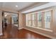 Spacious living room with natural light streaming through a large window at 2318 E Flower St, Phoenix, AZ 85016