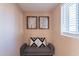 Cozy sitting area with stylish decor, including a comfortable bench, decorative pillows, and natural light at 2318 E Flower St, Phoenix, AZ 85016